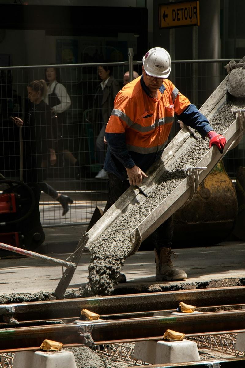 ready-mix delivery Close-up view of a ready-mix concrete truck delivering freshly mixed concrete at a construction site