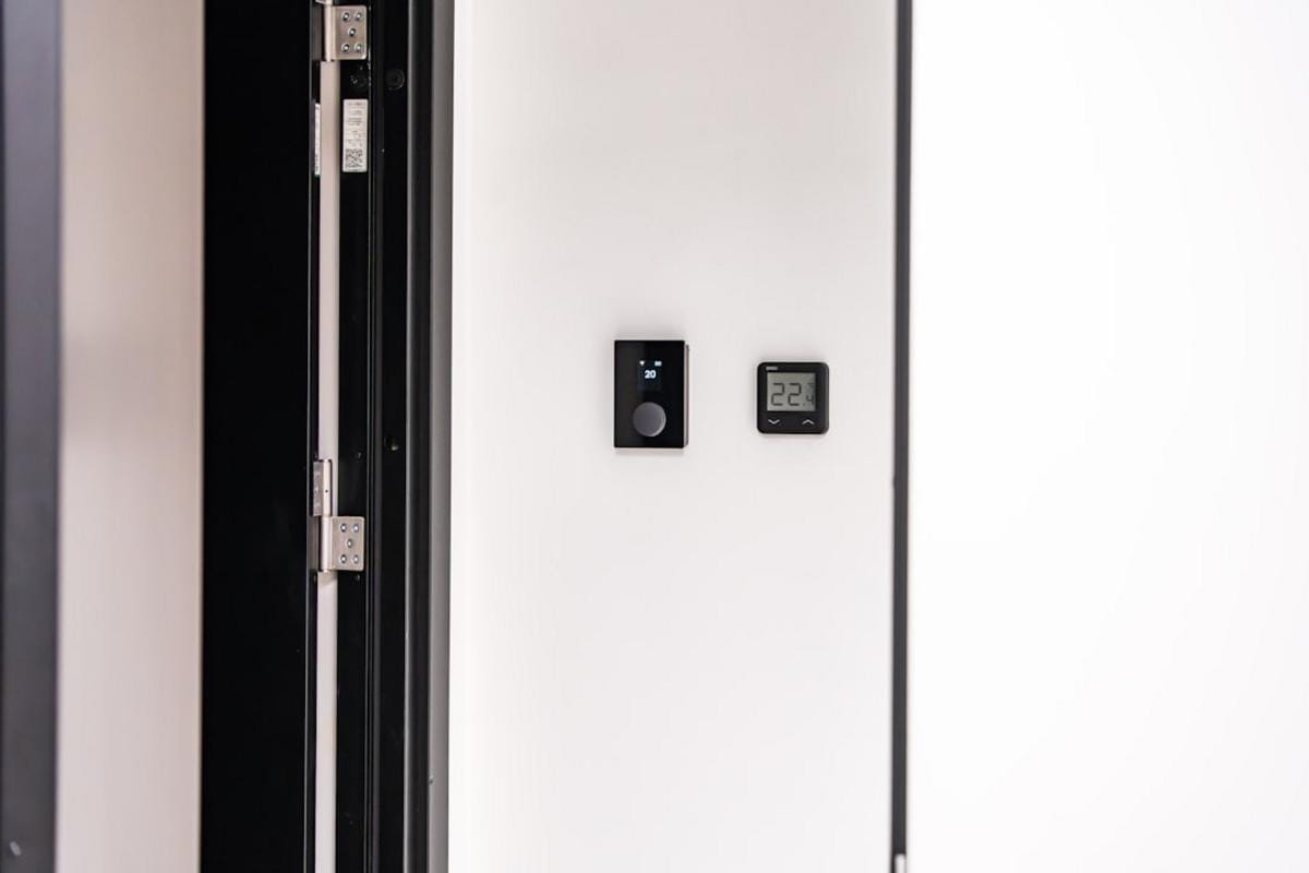 Close-up of automated control panels inside a modern ready-mix batching plant, emphasizing technological integration